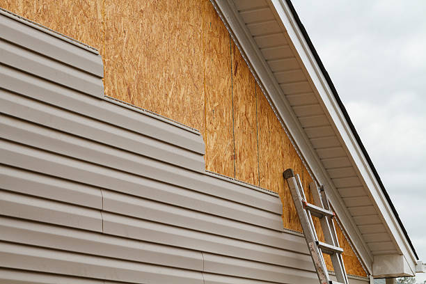 Professional Emergency Siding Repair technician working in Hamilton, OH